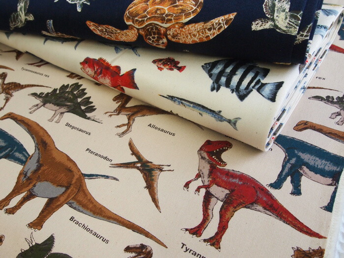 ハンドメイドグリーン。恐竜プリント×ギンガム切替片側紐出し巾着