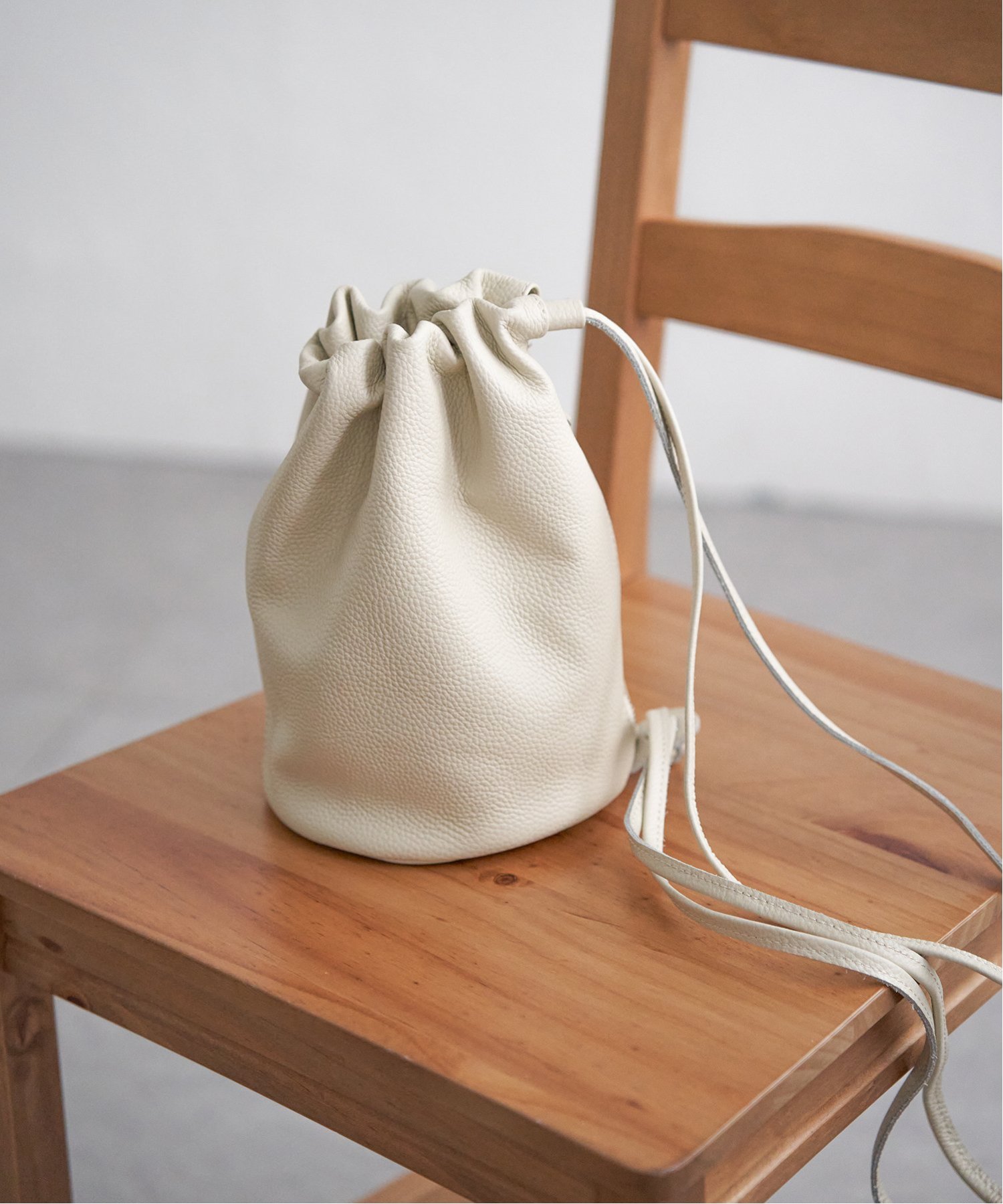 notch. 【sweet web掲載】COOCO シュリンクレザーロングショルダー巾着 