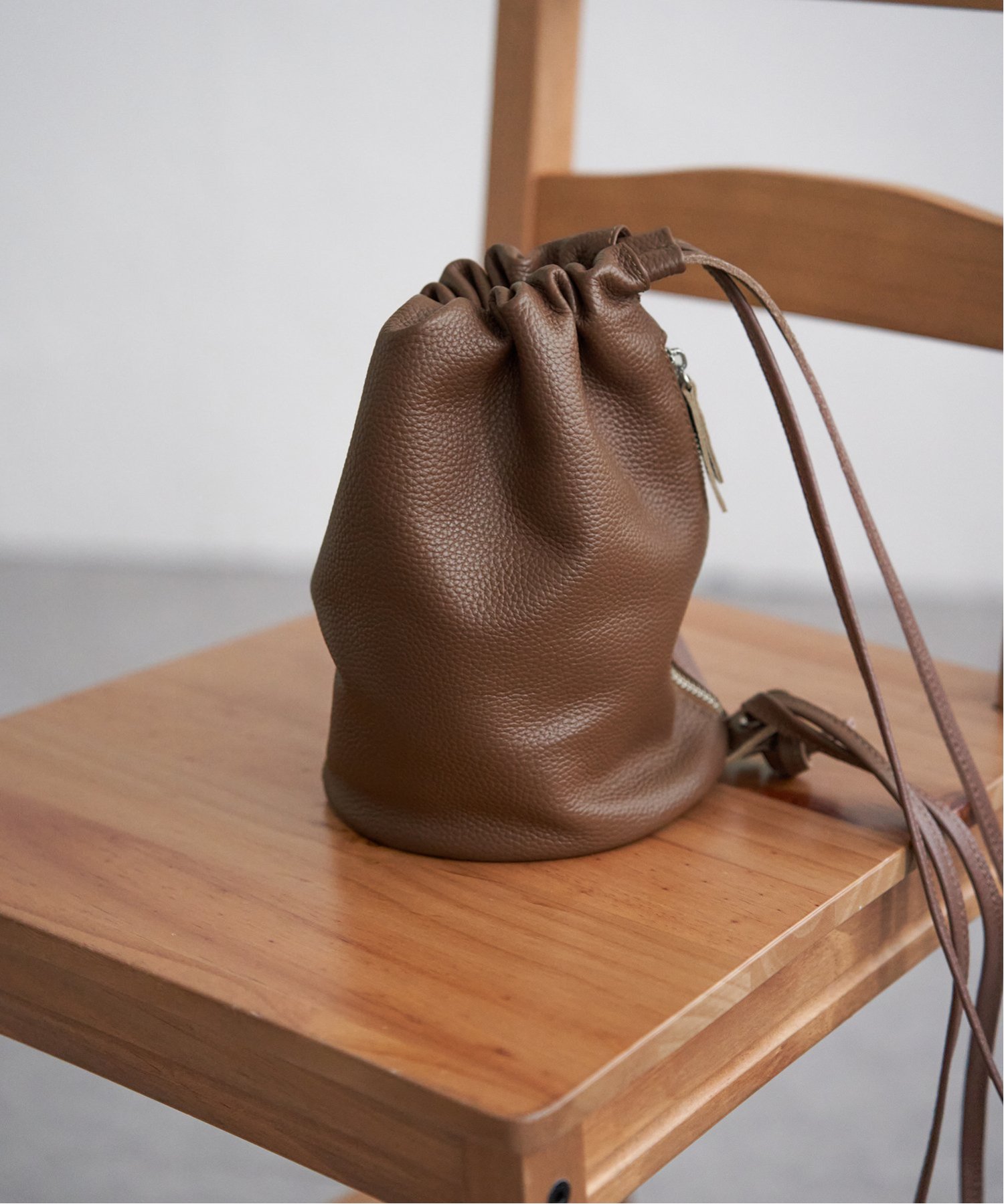 notch. 【sweet web掲載】COOCO シュリンクレザーロングショルダー巾着 