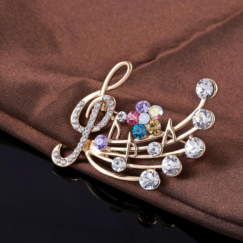 ブローチ 五線譜デザインラインストーンブローチ 送料無料 大人