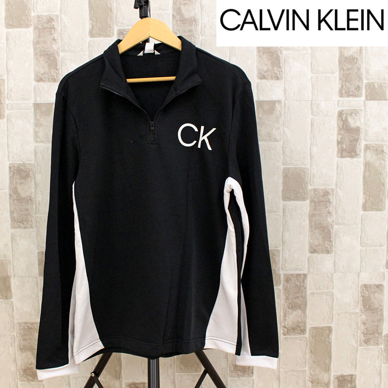 Calvin Klein CK モノグラム アイコニックスリーブ クルーネックスウェットシャツ MO...