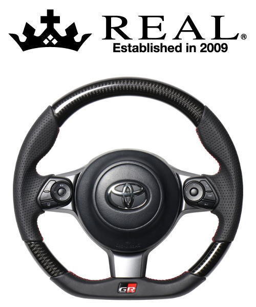 REAL STEERING オリジナルシリーズ エンブレムタイプ スバル BRZ 後期 ZC6用 ブラックカーボン レッド×ブラックユーロステッチ GRM-BKC-RD | REAL（車）